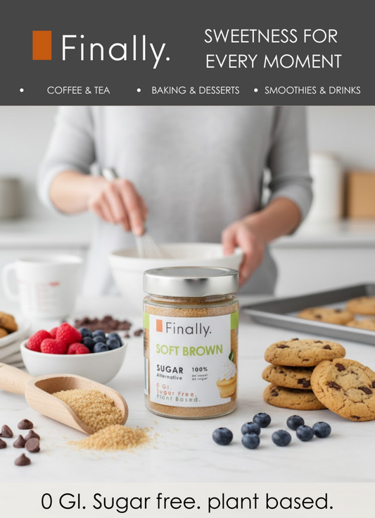 Bottle of 'Finally' soft brown sugar alternative on a kitchen counter with cookies and berries.