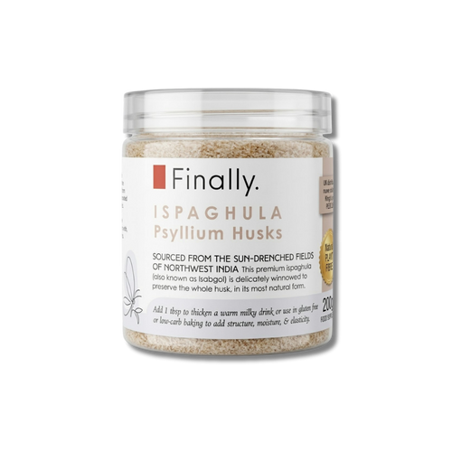 A product shot of a clear glass jar of Finally brand "ISPAGHULA Psyllium Husks", isolated on a transparent checkered background. The jar is filled with fine, beige flakes of psyllium husks. The white label indicates that the product is sourced from Northwest India and describes it as premium ispaghula to add structure, moisture, and elasticity to gluten-free or low-carb baking.