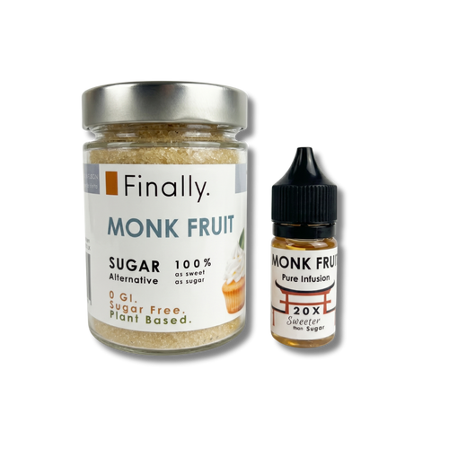 A product shot of Finally brand monk fruit sweetening products, isolated against a transparent checkered background. On the left is a large clear glass jar with a silver screw-top lid, filled with golden-brown granulated "MONK FRUIT Sugar Alternative". To its right stands a small dropper bottle with a black cap labeled "MONK FRUIT Pure Infusion", containing a concentrated golden liquid.